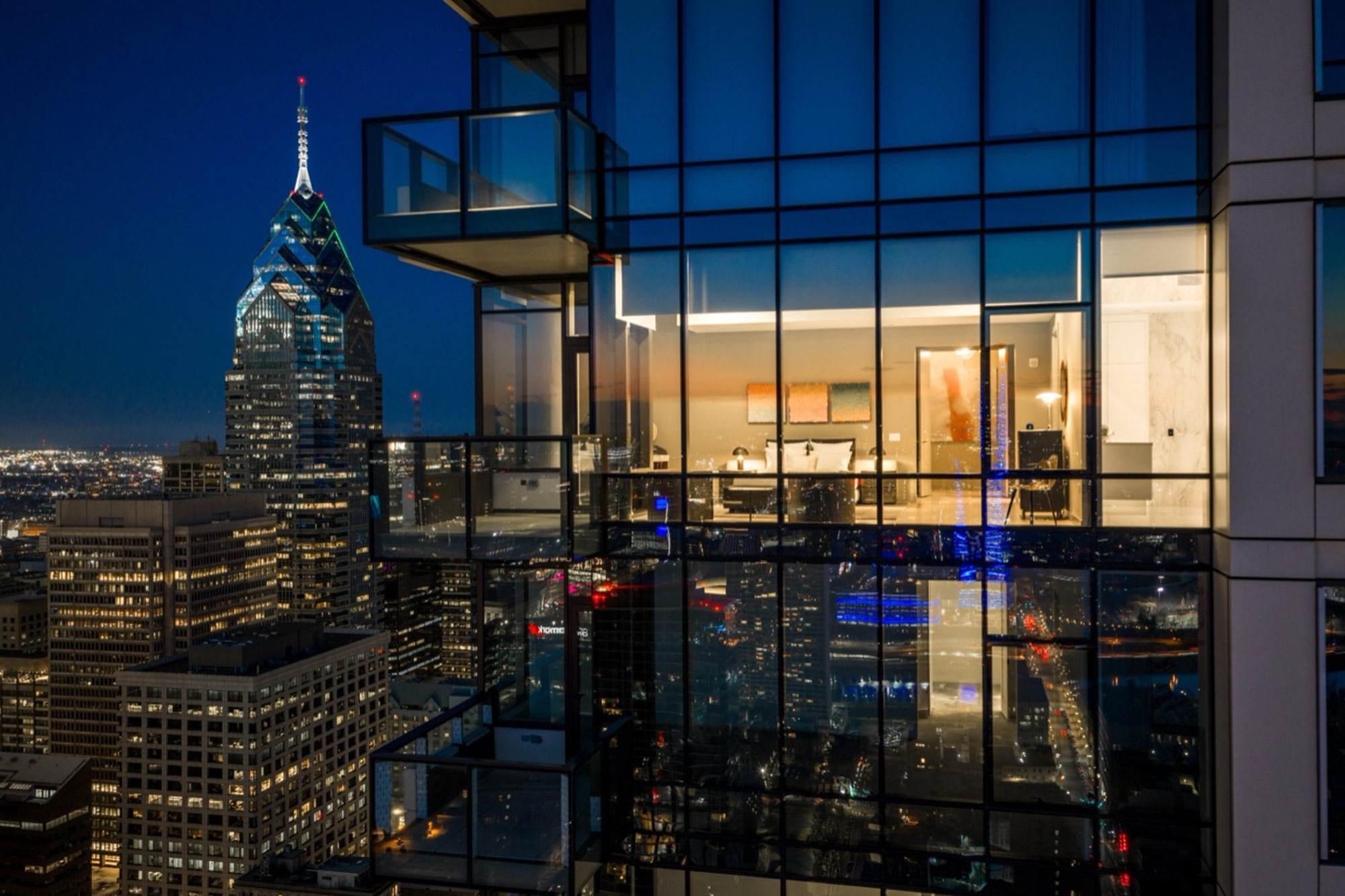 The Laurel Rittenhouse Square luxury condominium glass exterior overlooking the Philadelphia skyline at dusk